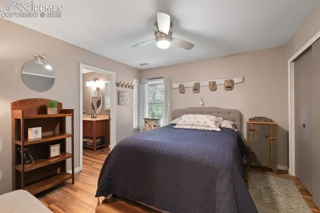 a bedroom with a bed and a closet