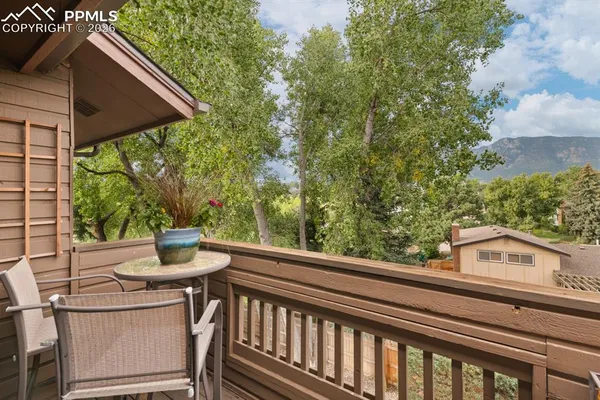 a view of a two chairs in the balcony