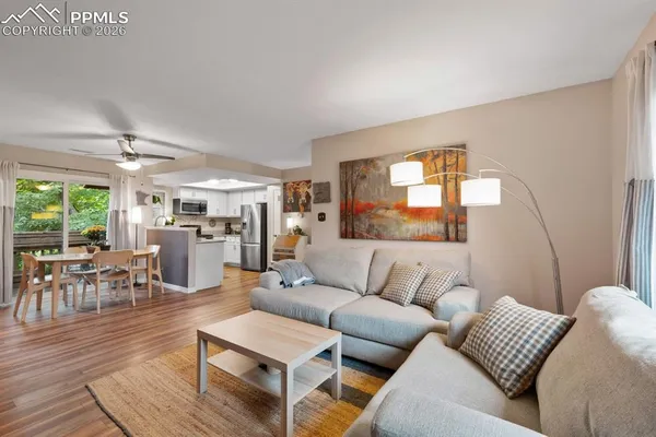a living room with furniture and a large window