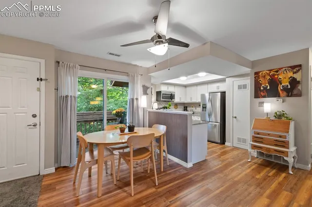 a dining room with furniture and window