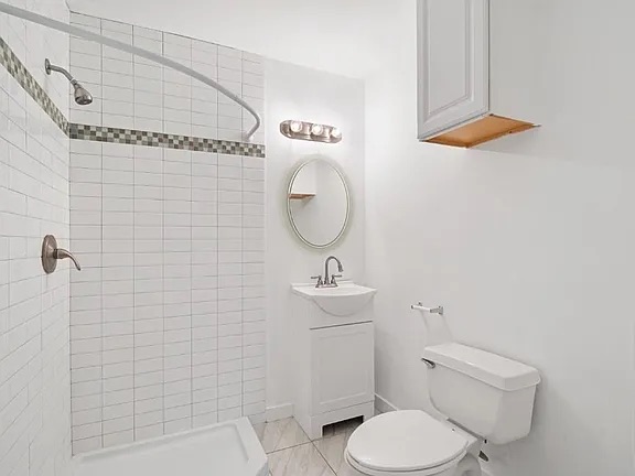1302 South Quinlan Park Road Austin, TX 78732 - Photo 18 of 40 Bathroom featuring a shower stall and vanity