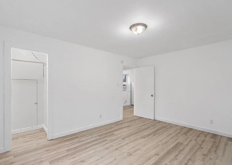 1302 South Quinlan Park Road Austin, TX 78732 - Photo 20 of 40 Spare room with light wood-style flooring