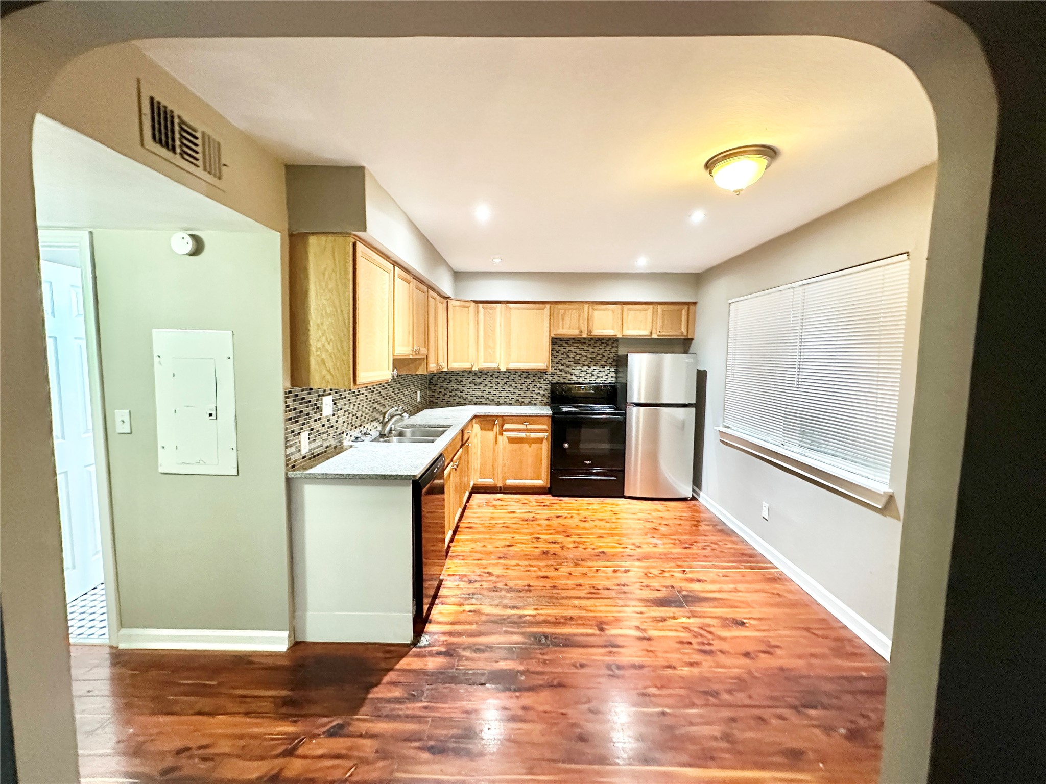1302 South Quinlan Park Road Austin, TX 78732 - Photo 24 of 40 a kitchen with stainless steel appliances granite countertop a refrigerator and a sink
