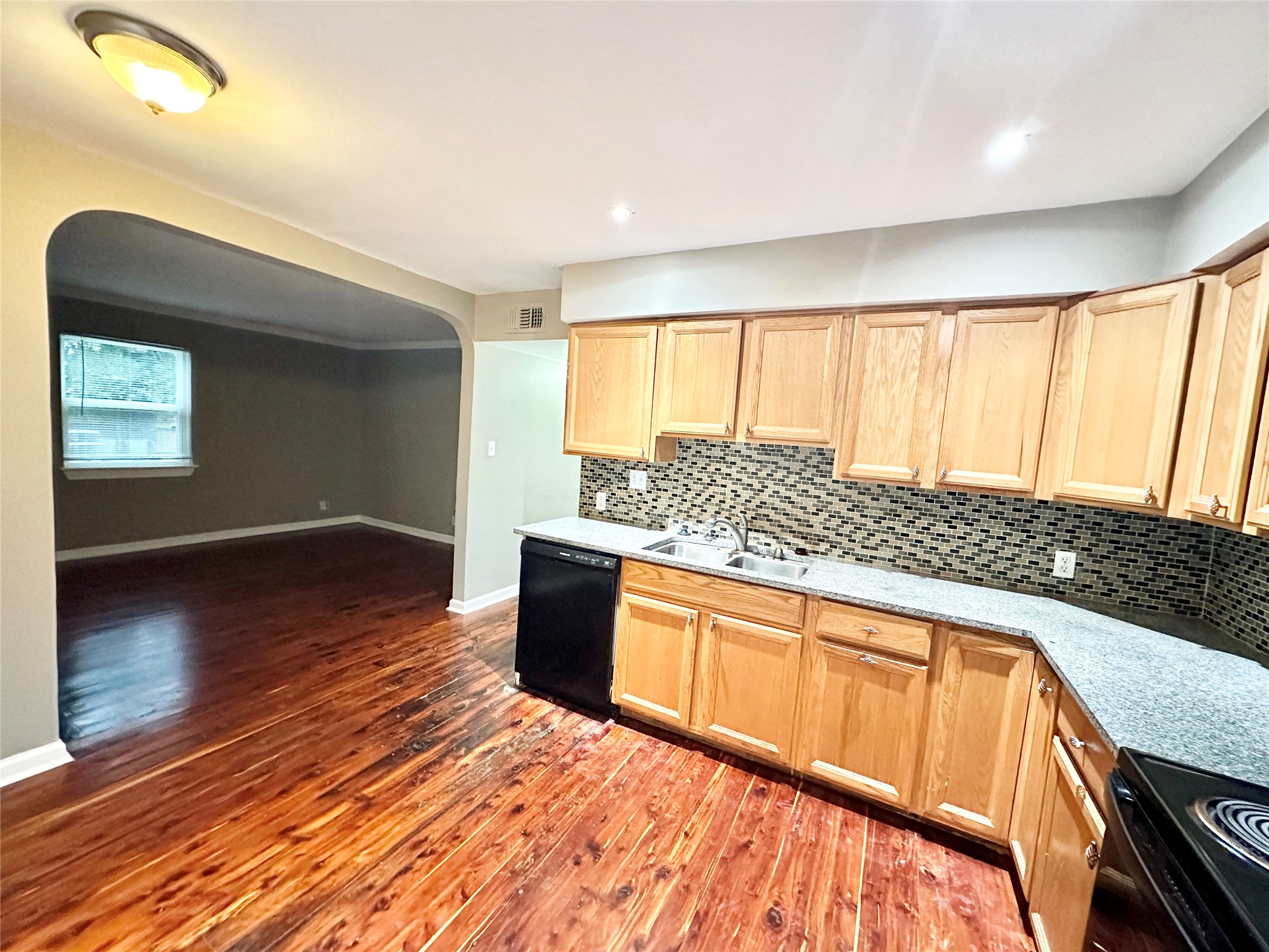 1302 South Quinlan Park Road Austin, TX 78732 - Photo 25 of 40 a view of a kitchen with a sink and wooden floor
