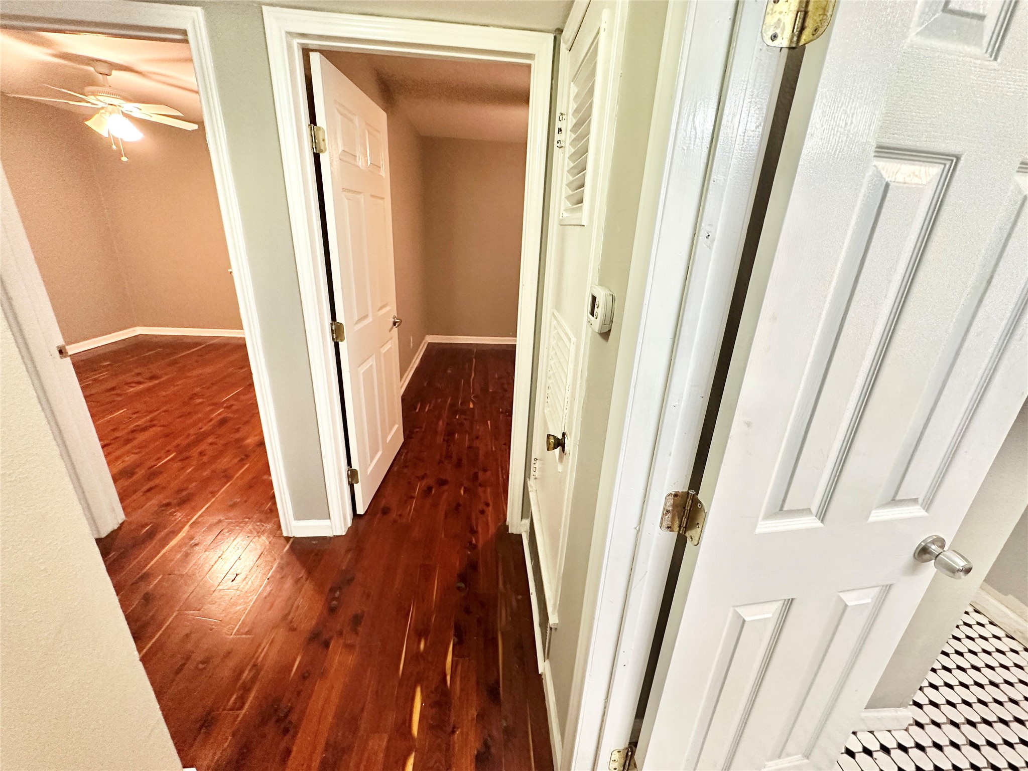 1302 South Quinlan Park Road Austin, TX 78732 - Photo 30 of 40 a view of a hallway with wooden floor and staircase