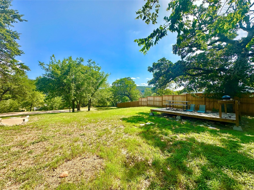 1302 South Quinlan Park Road Austin, TX 78732 - Photo 38 of 40 View of yard with a wooden deck
