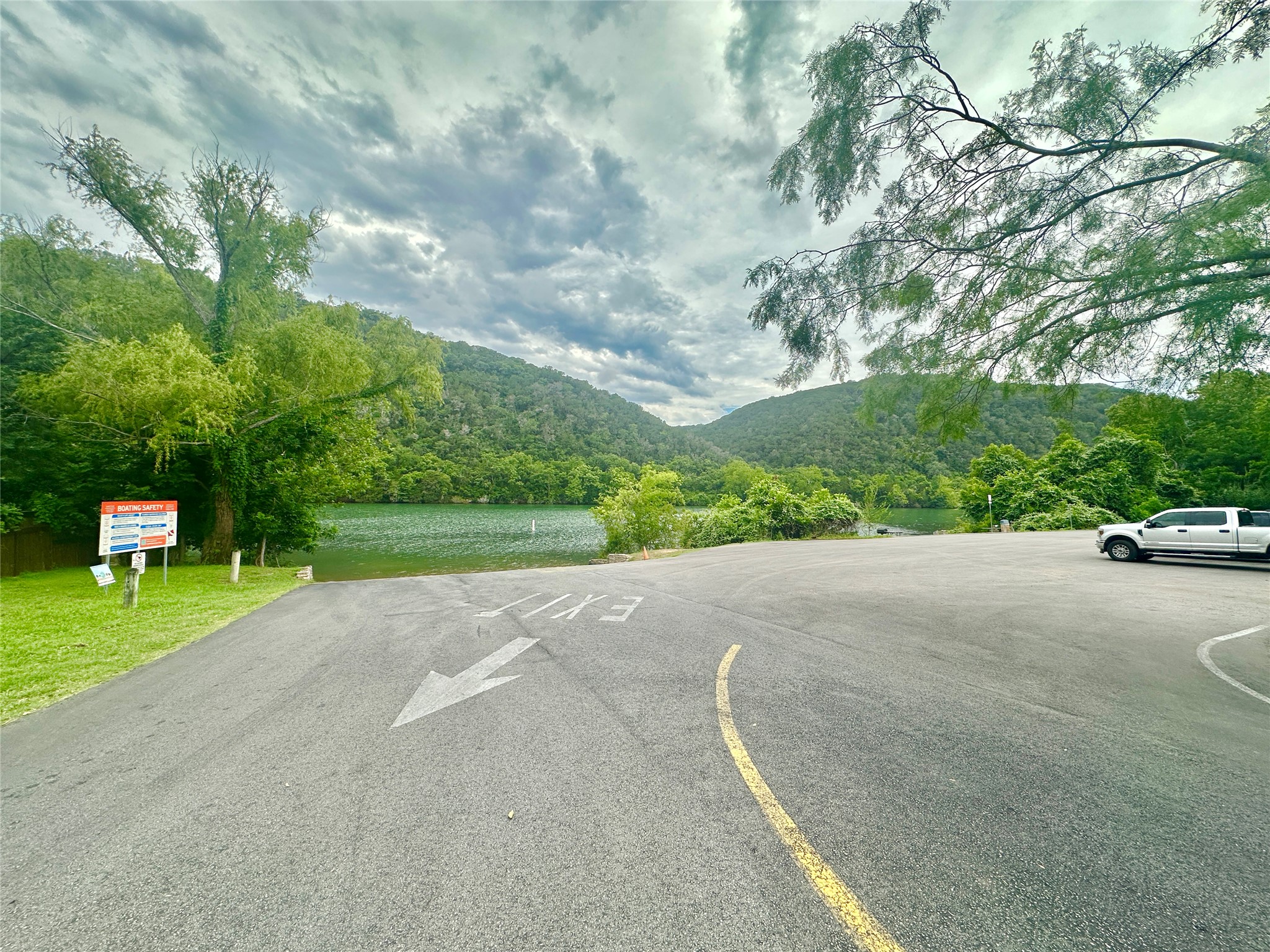 1302 South Quinlan Park Road Austin, TX 78732 - Photo 8 of 40 View of boat ramp featuring a lake and mountain view