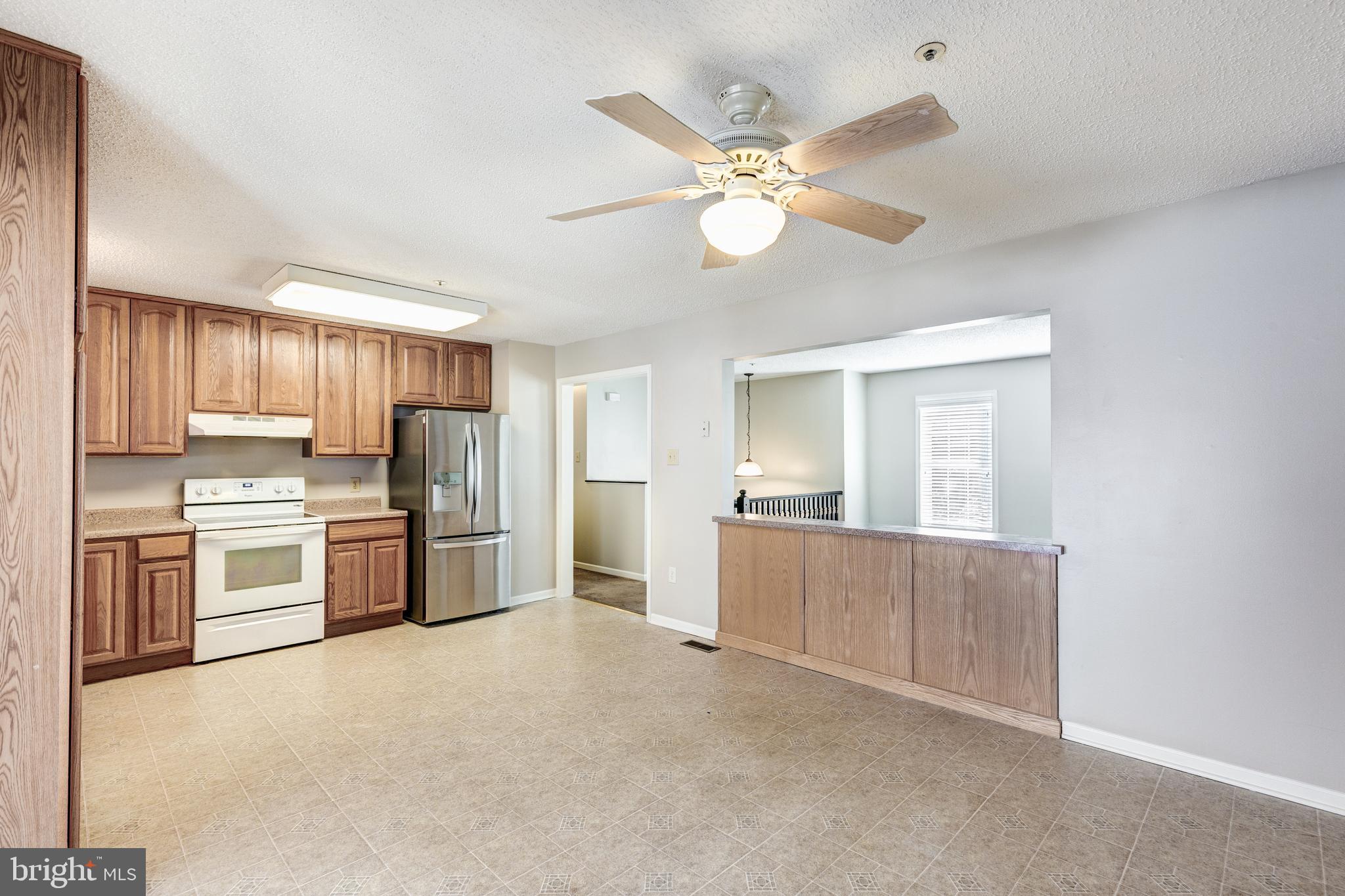 306 North Cranberry Road Westminster, MD 21157 - Photo 8 of 26 KITCHEN LOOKING INTO LIVING ROOM