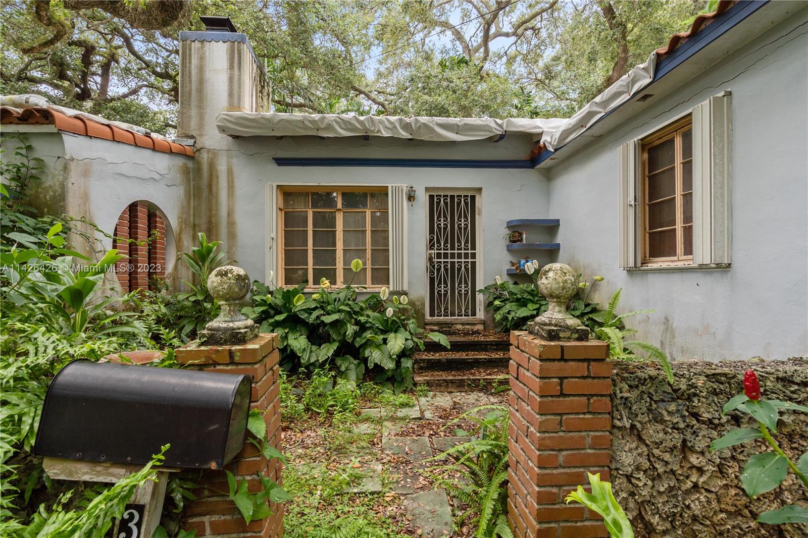 355 Northeast 86th Street El Portal, FL 33138 - Photo 1 of 23 a view of a house with potted plants