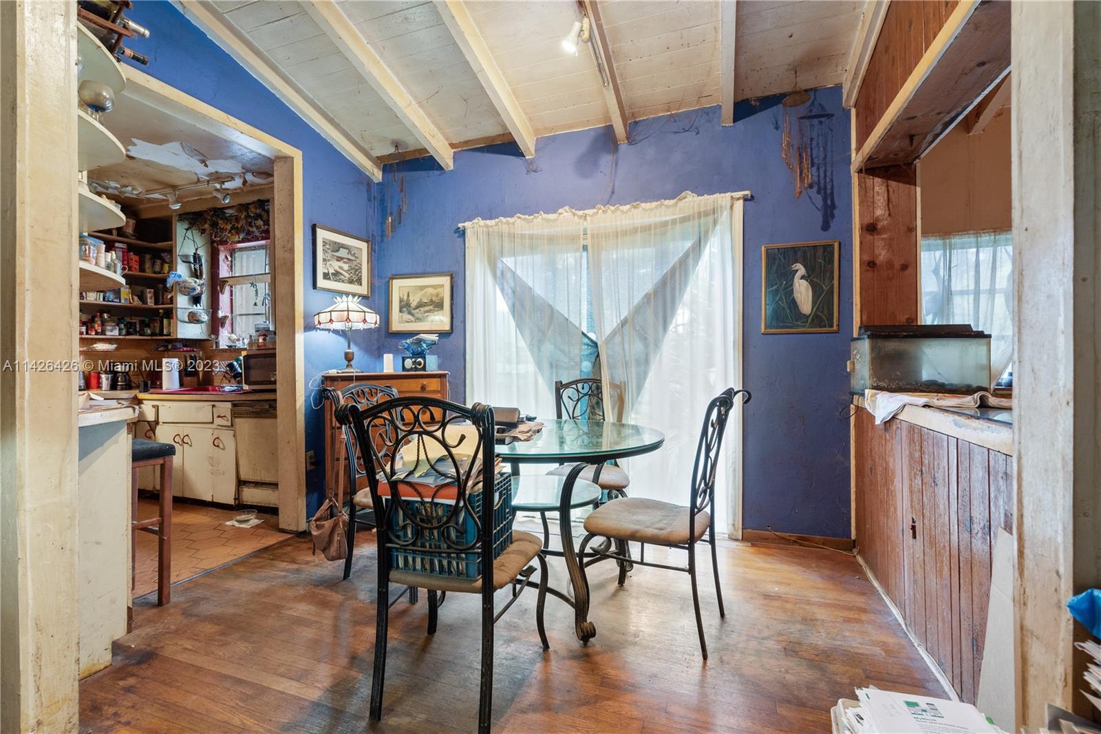 355 Northeast 86th Street El Portal, FL 33138 - Photo 5 of 23 a view of a dining room with furniture and wooden floor
