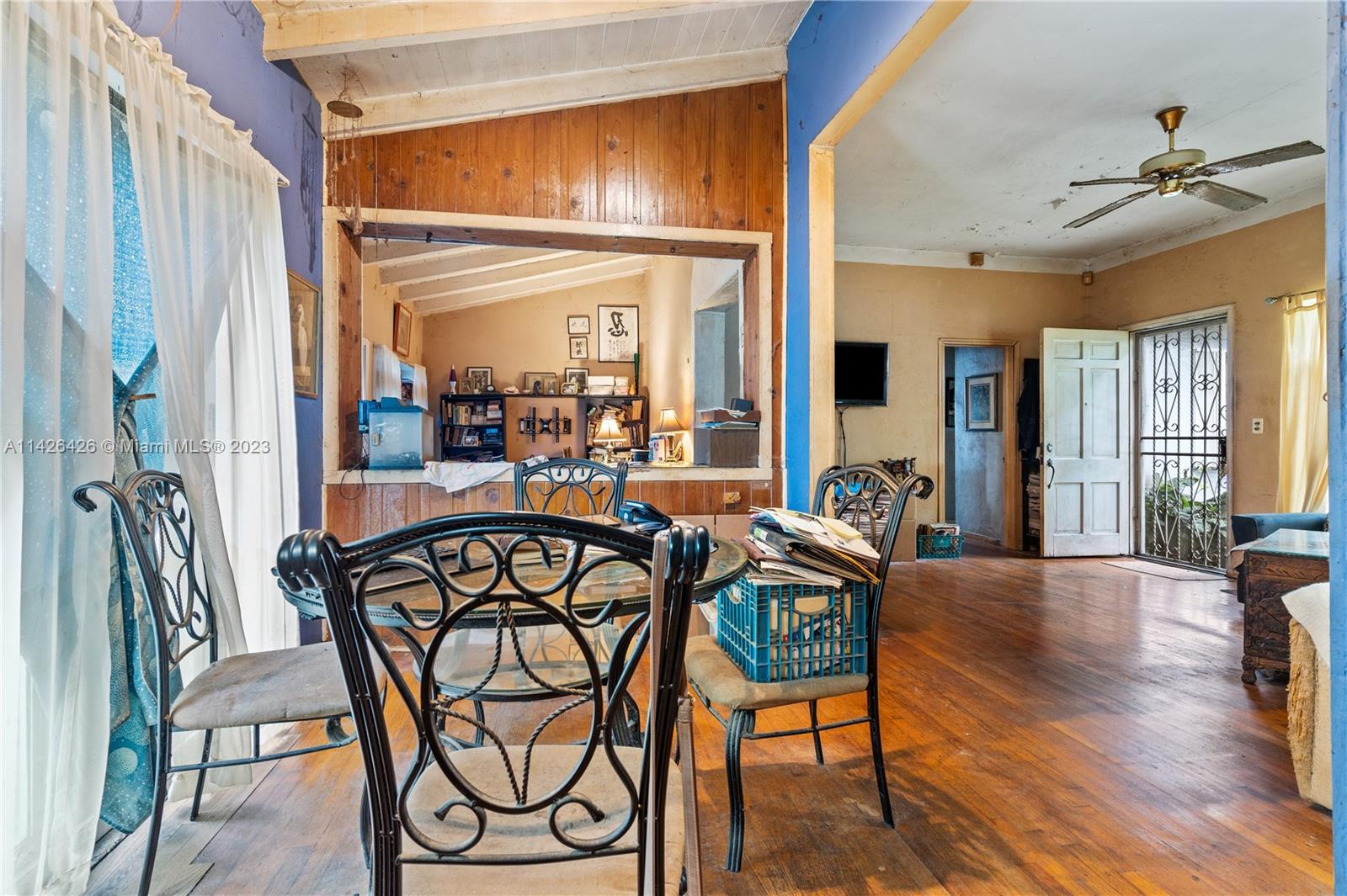 355 Northeast 86th Street El Portal, FL 33138 - Photo 7 of 23 a view of a a dining room with furniture window and wooden floor