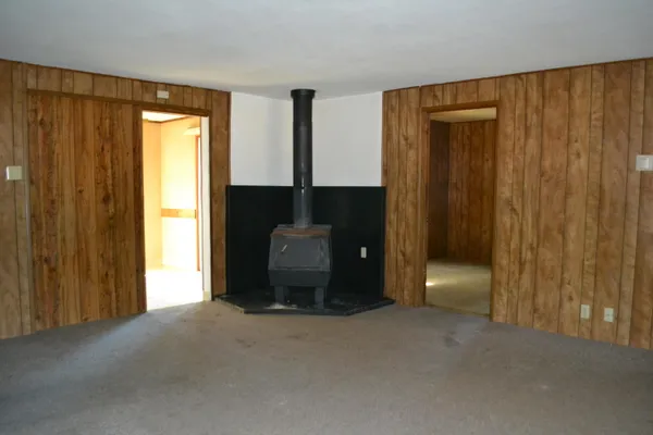 a view of a room with a window and a door