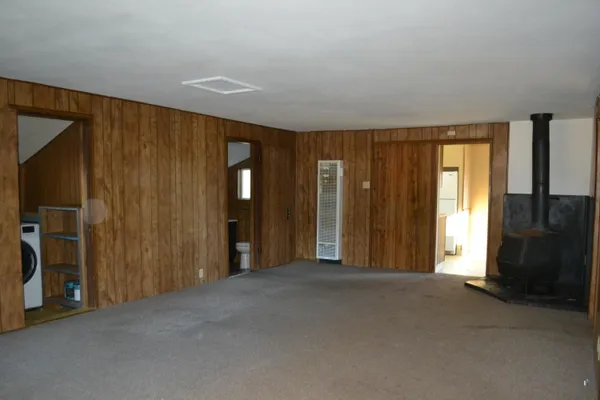 a view of a bathroom with shower and a bed