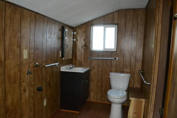 a kitchen with a sink cabinets and a refrigerator