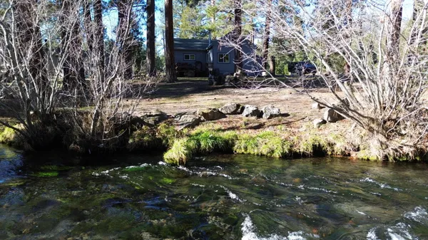 a backyard of a house with lots of green space