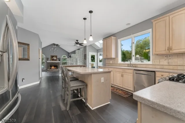 a kitchen with sink cabinets and wooden floor