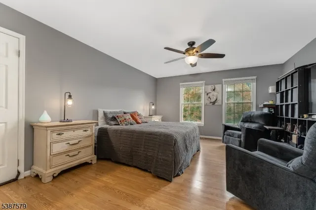 a living room with furniture a chandelier and a window