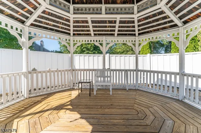 a view of a balcony with wooden floor