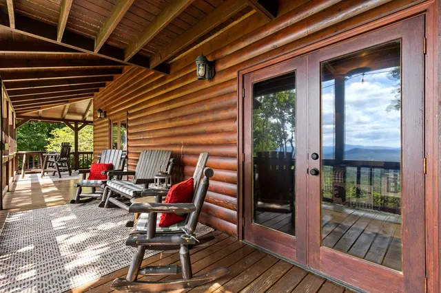 a view of a house with pool and deck