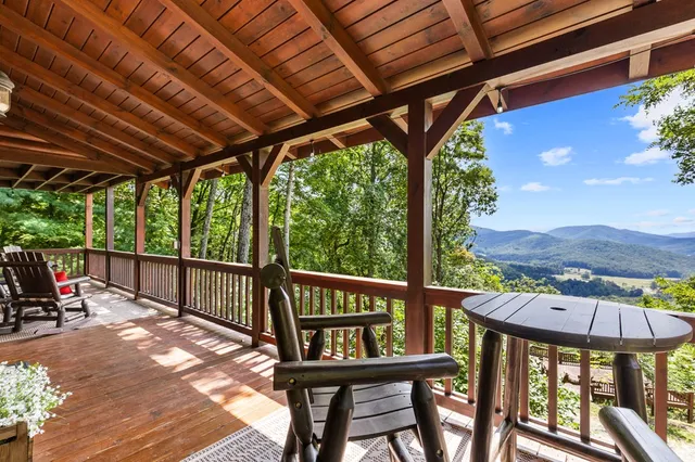 a living room with furniture ceiling fan and a rug