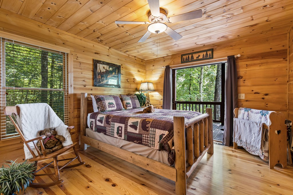 16 Enchanting Circle Morganton, GA 30560 - Photo 16 of 57 a bed sitting in a spacious bedroom next to a window