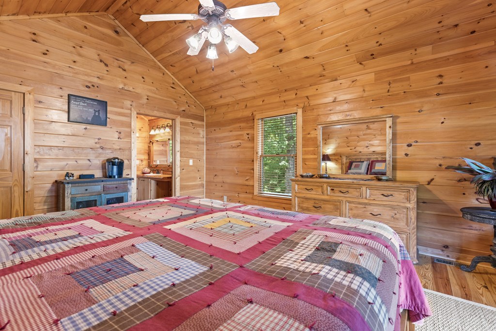 16 Enchanting Circle Morganton, GA 30560 - Photo 22 of 57 a bed sitting in a bedroom next to a window