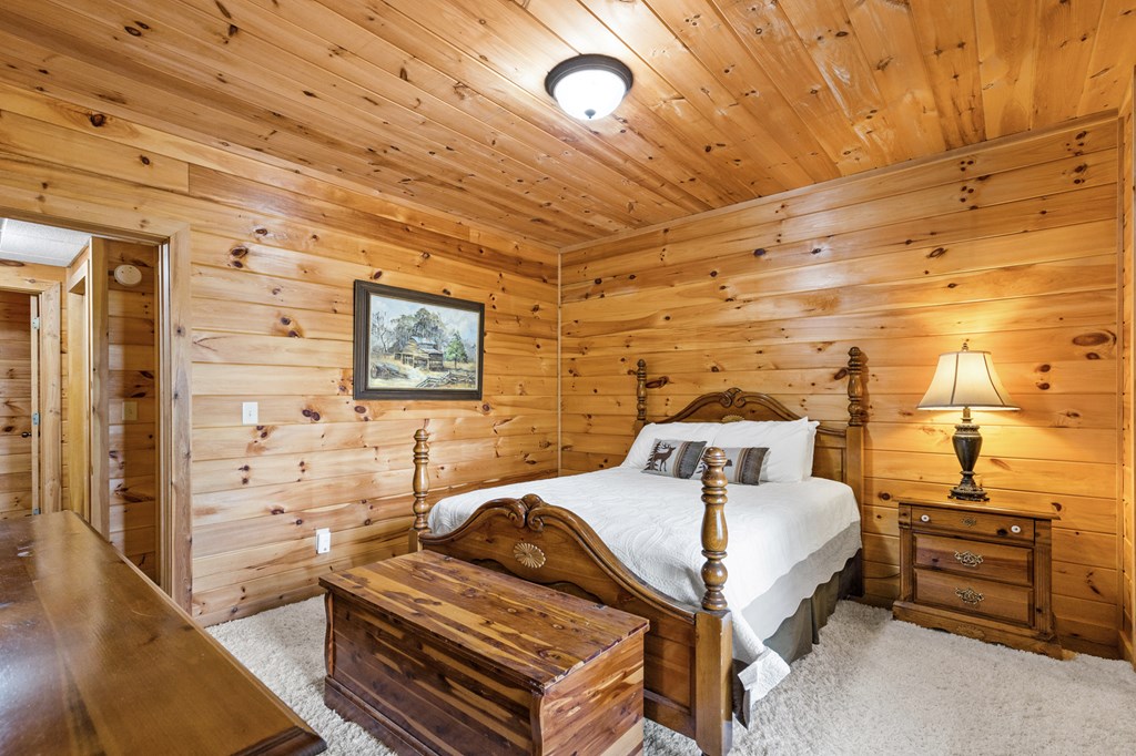 16 Enchanting Circle Morganton, GA 30560 - Photo 27 of 57 a bedroom with a bed and wooden floor