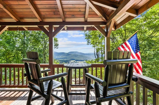 a view of a patio with a table and chairs