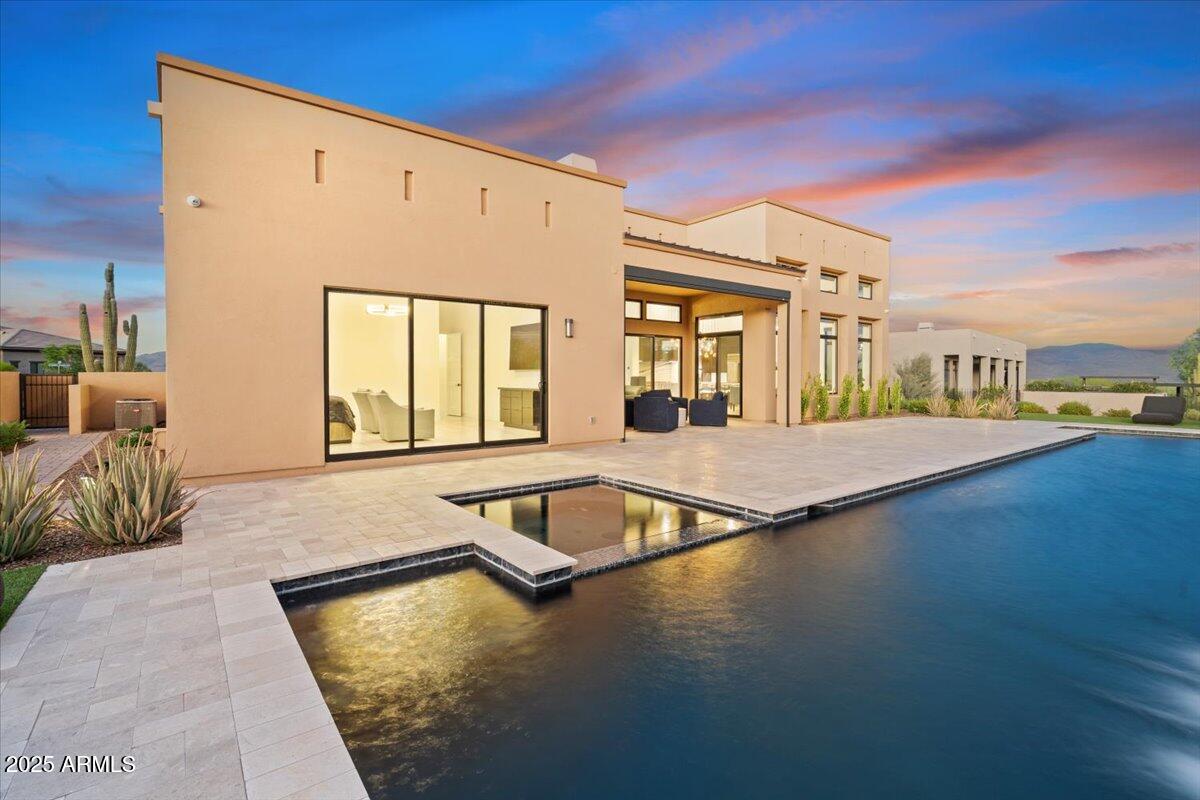 17237 East Desert Vista Trail Rio Verde, AZ 85263 - Photo 30 of 95 a view of a swimming pool and lounge chair