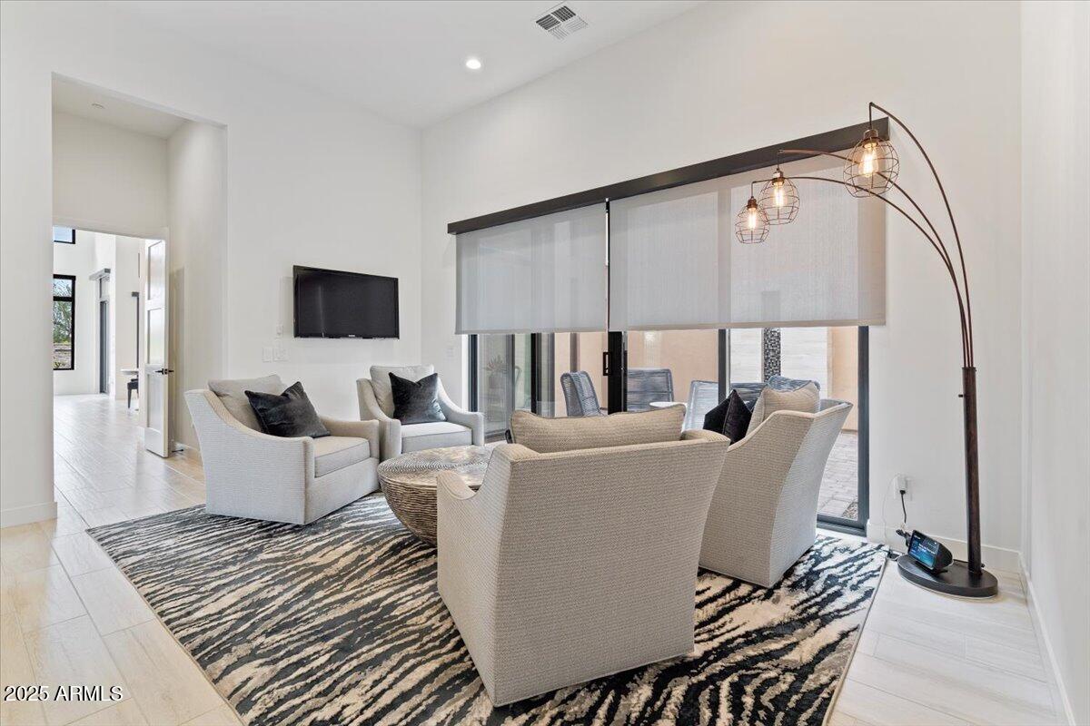 17237 East Desert Vista Trail Rio Verde, AZ 85263 - Photo 53 of 95 a living room with furniture and a flat screen tv