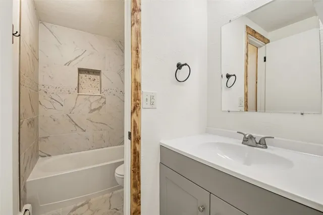 a view of a room with wooden floor and closet