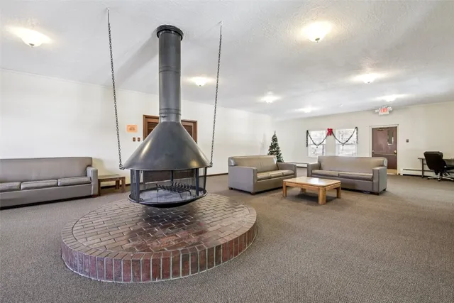 a view of a livingroom with furniture a flat screen tv