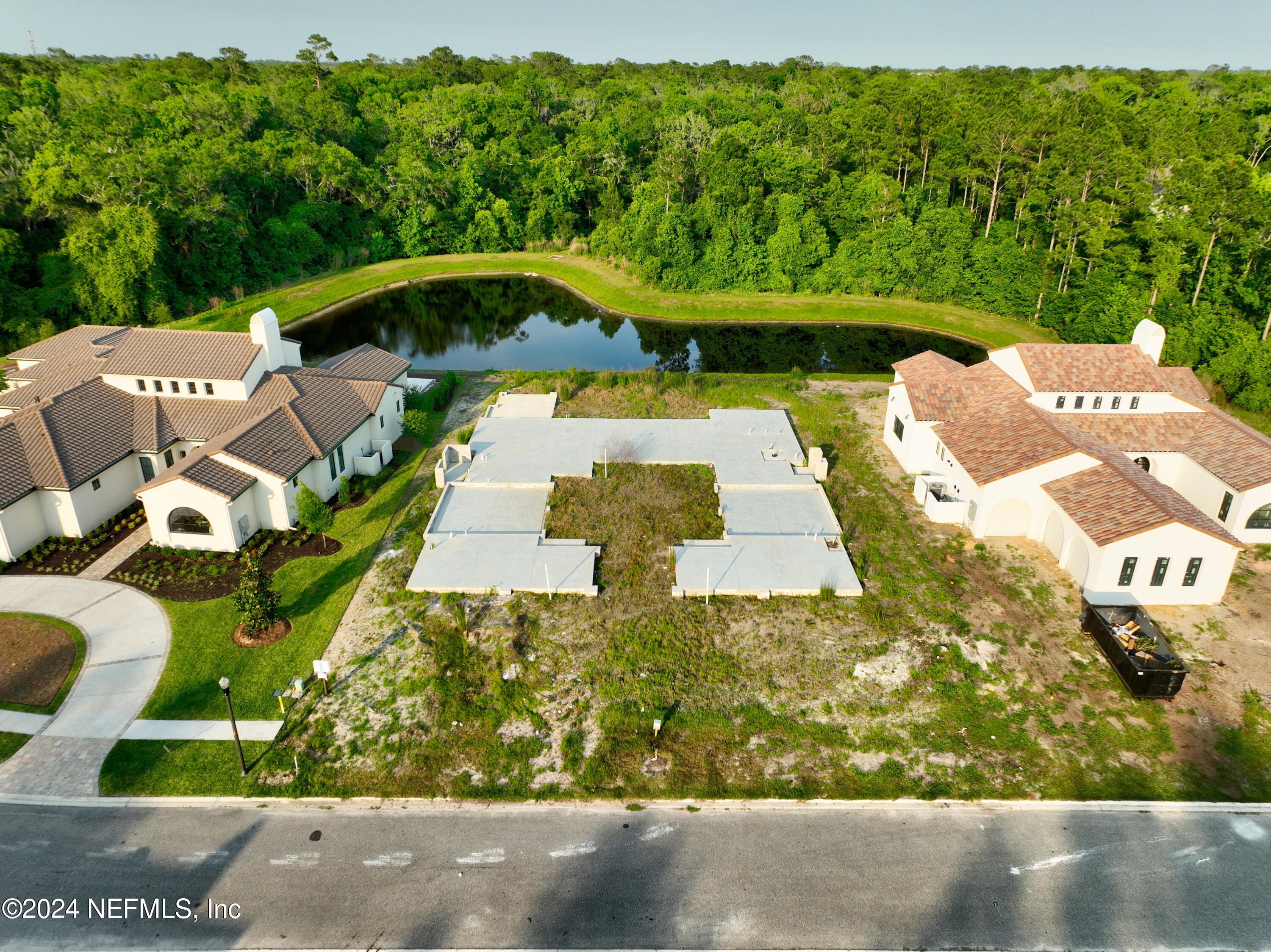 92 Bear Point Ponte Vedra, FL 32081 - Photo 1 of 21 an aerial view of a house with swimming pool garden and patio