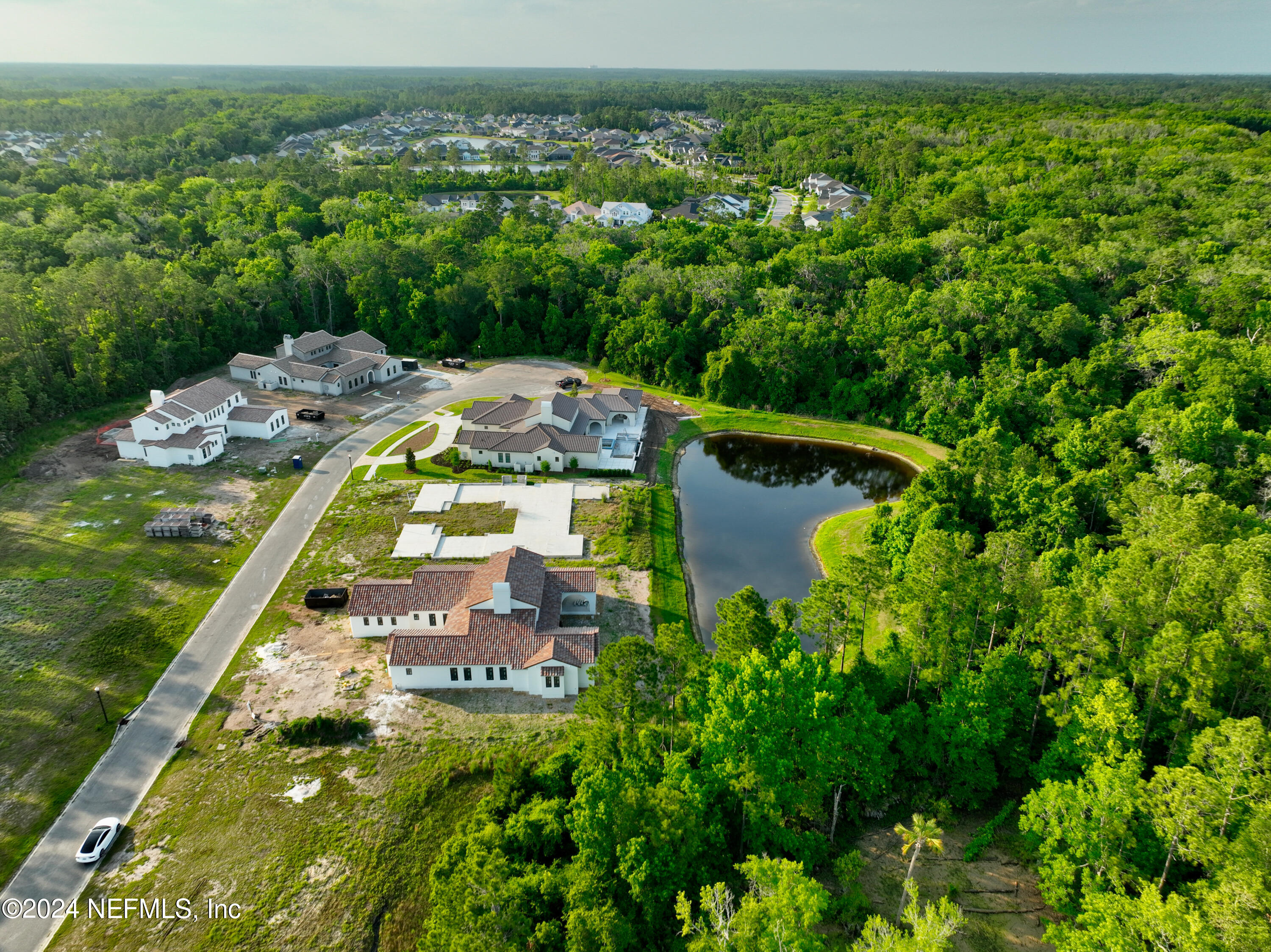 92 Bear Point Ponte Vedra, FL 32081 - Photo 7 of 21 view of a lake with a building in the background