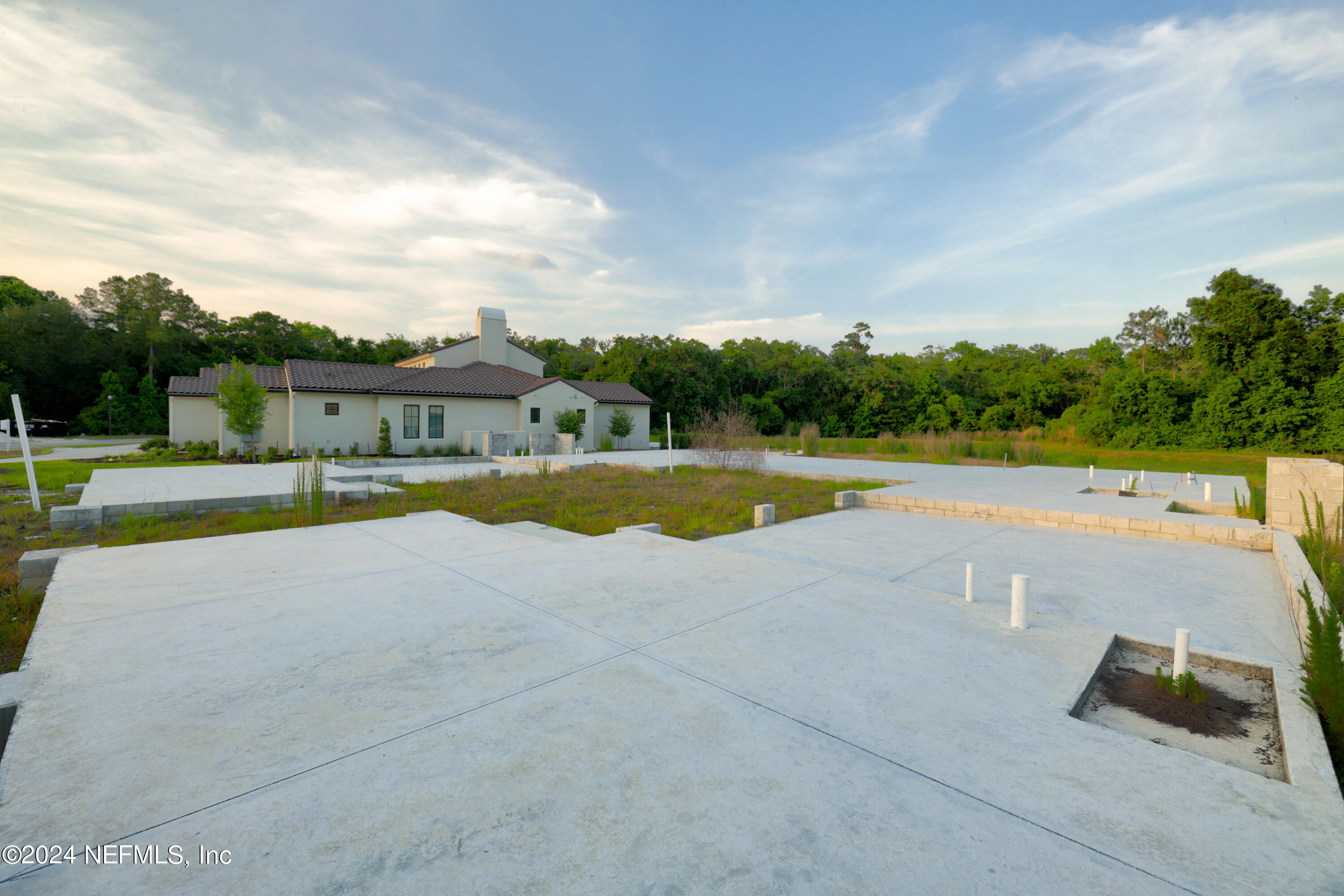 92 Bear Point Ponte Vedra, FL 32081 - Photo 9 of 21 a view of swimming pool with seating area and trees in the background
