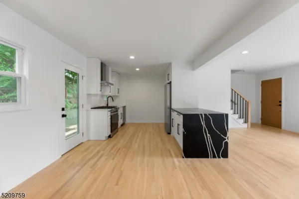 a view of kitchen and wooden floor