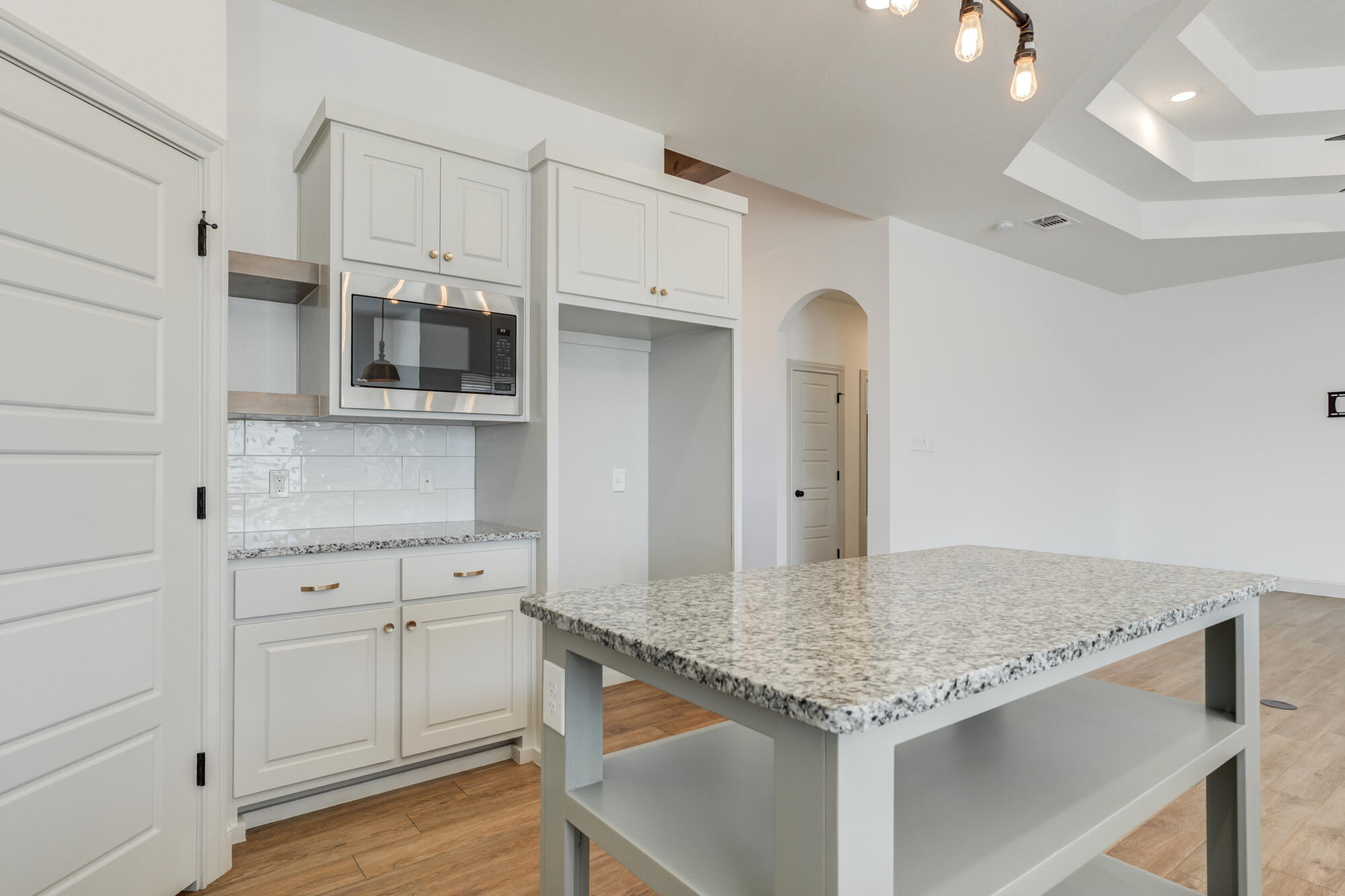 6805 51st Street Lubbock, TX 79407 - Photo 13 of 41 a kitchen with granite countertop a sink and cabinets