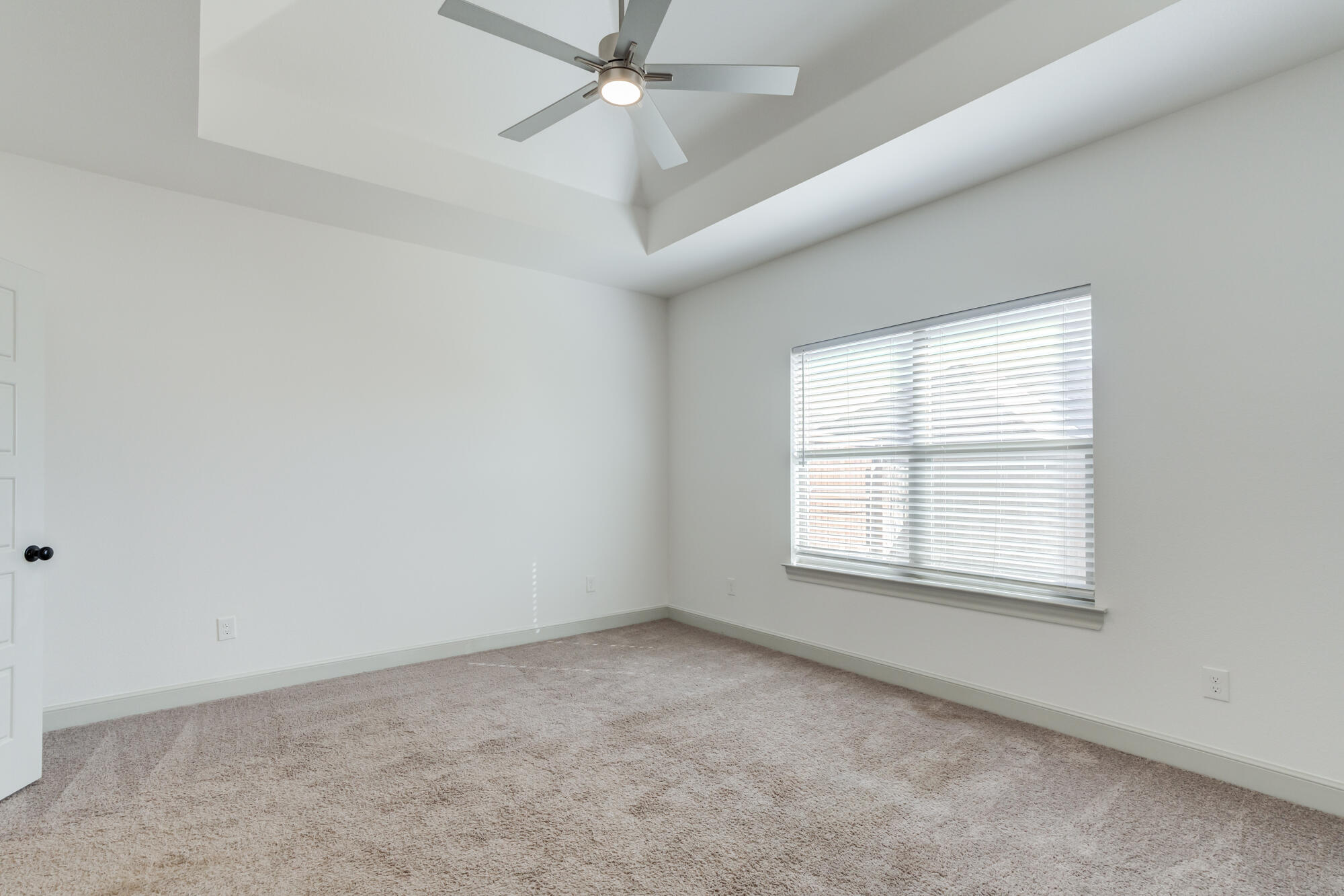 6805 51st Street Lubbock, TX 79407 - Photo 20 of 41 an empty room with a window and a fan