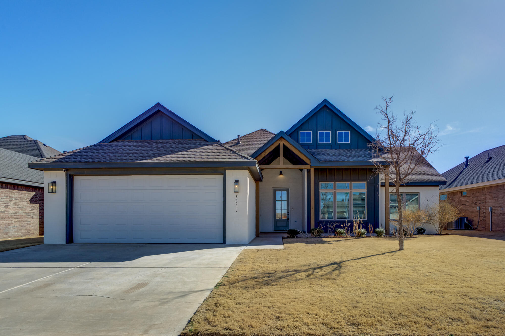 6805 51st Street Lubbock, TX 79407 - Photo 2 of 41 a front view of a house with a yard