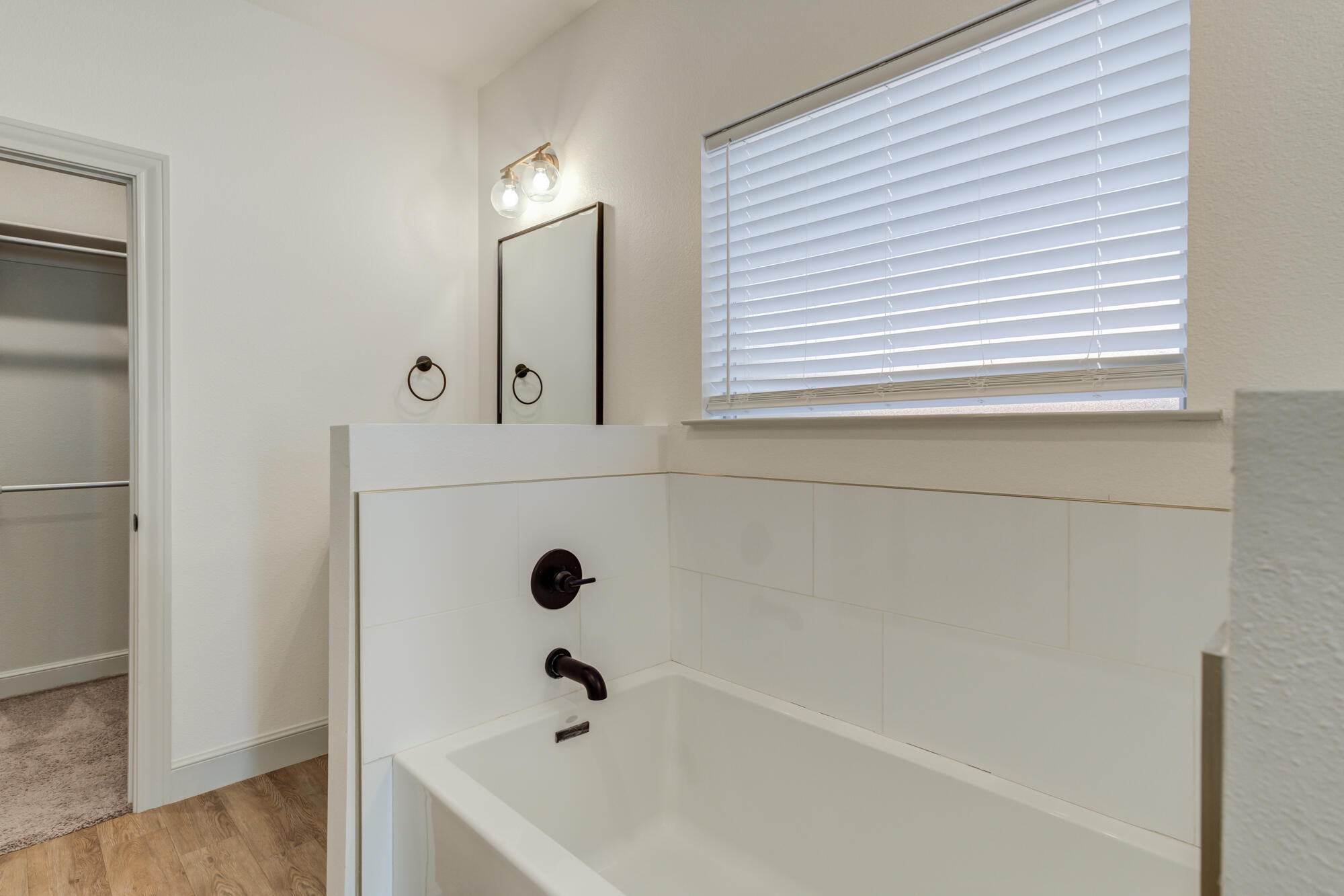 6805 51st Street Lubbock, TX 79407 - Photo 23 of 41 a bathroom with a bathtub and shower