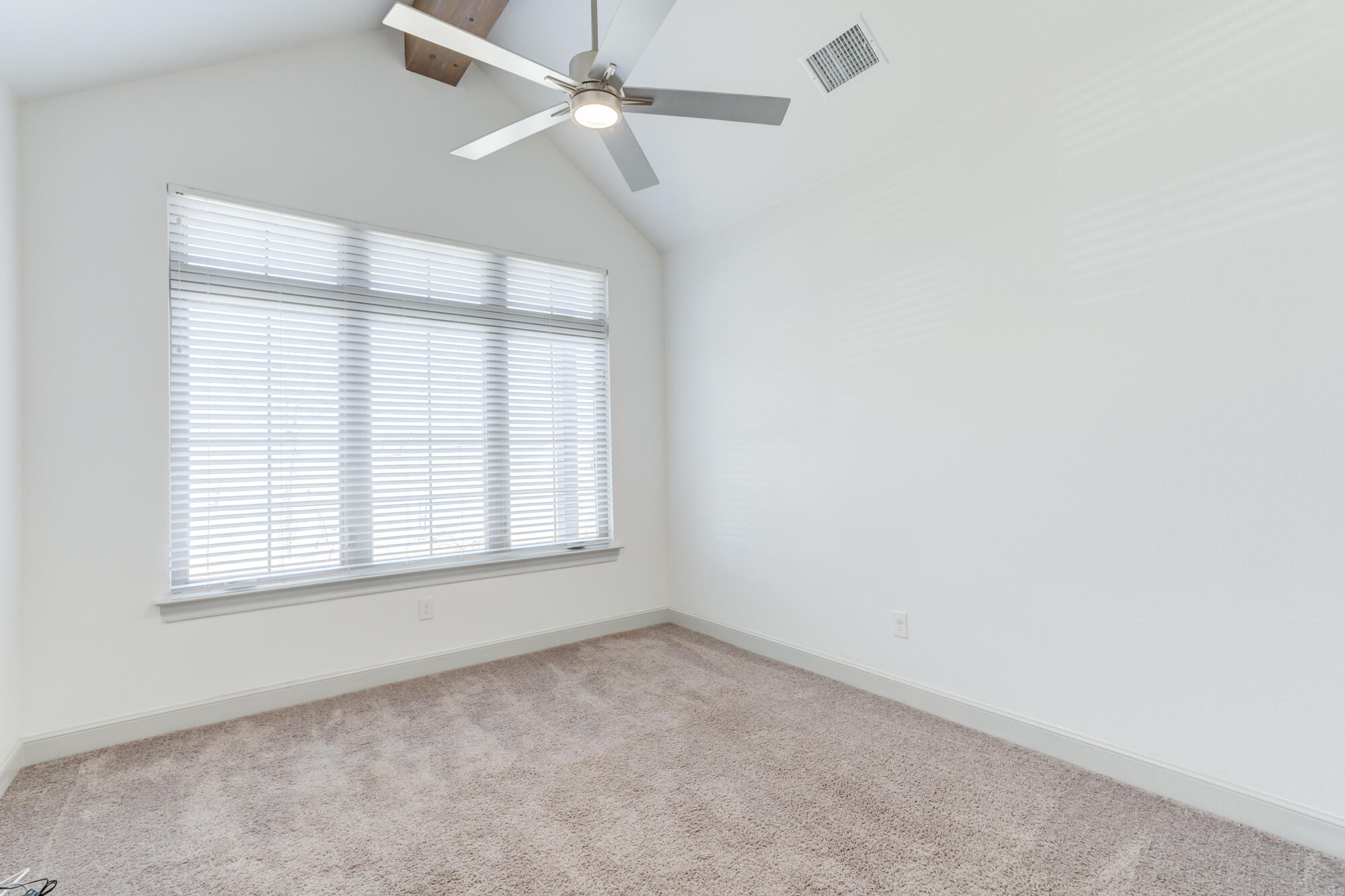 6805 51st Street Lubbock, TX 79407 - Photo 28 of 41 an empty room with a window and a fan