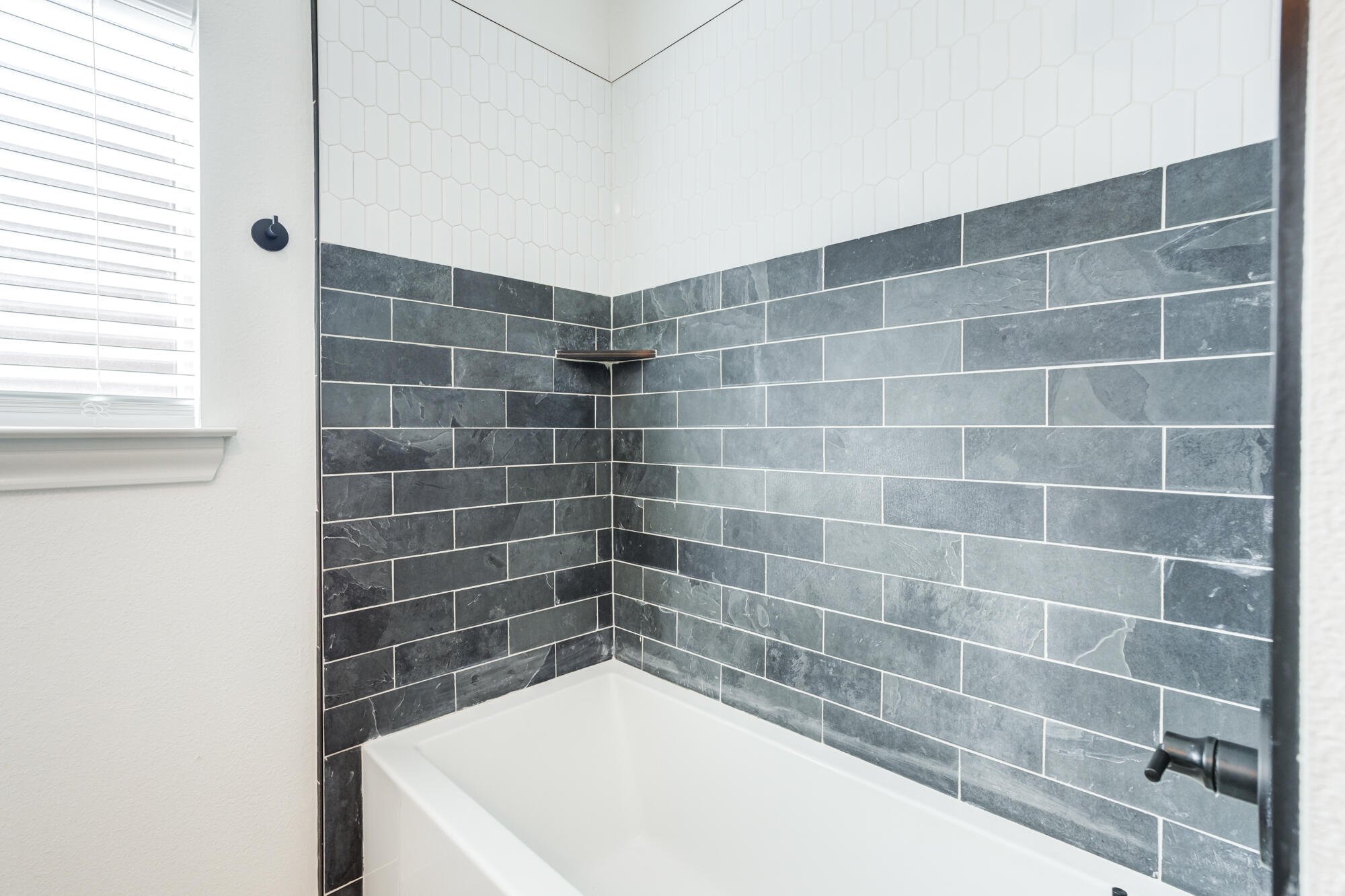 6805 51st Street Lubbock, TX 79407 - Photo 32 of 41 a bathroom with a bathtub