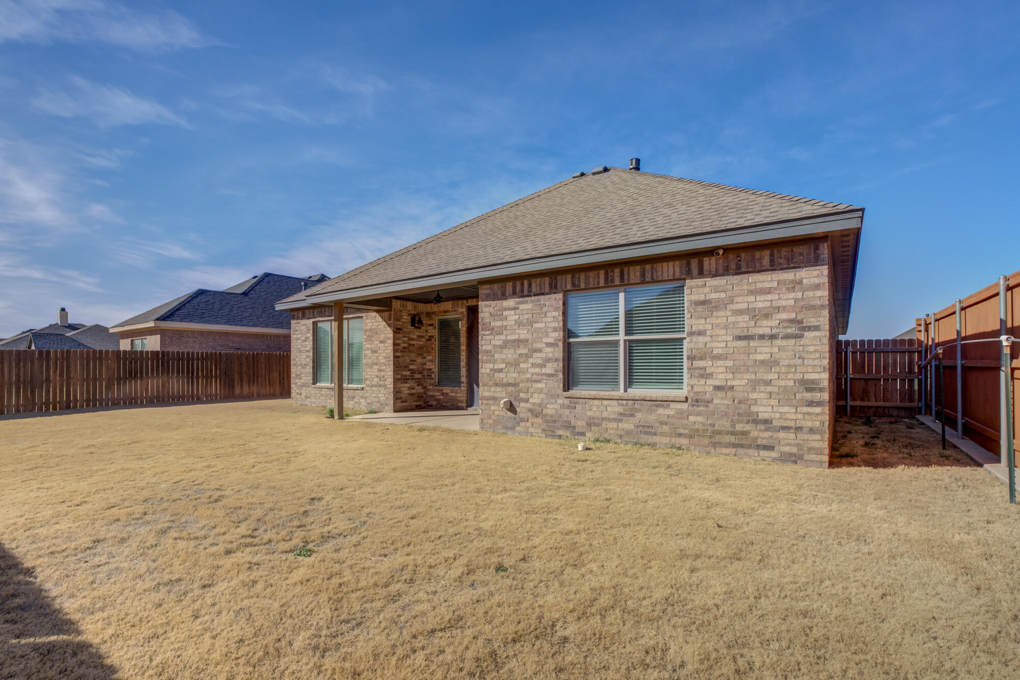 6805 51st Street Lubbock, TX 79407 - Photo 40 of 41 a front view of a house with a yard