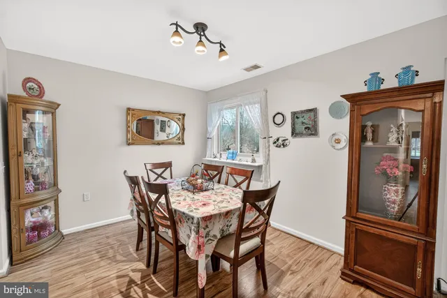 a view of a livingroom with furniture and wooden floor