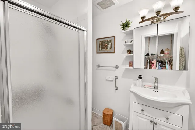 a white toilet sitting next to a bathroom sink