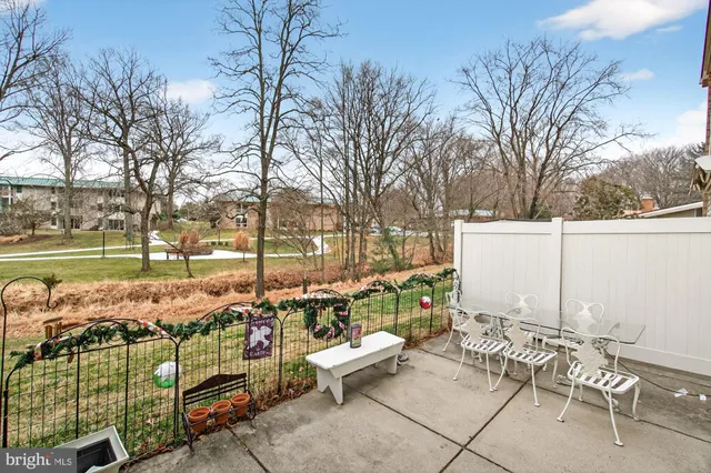 a view of a door with a chair and a table
