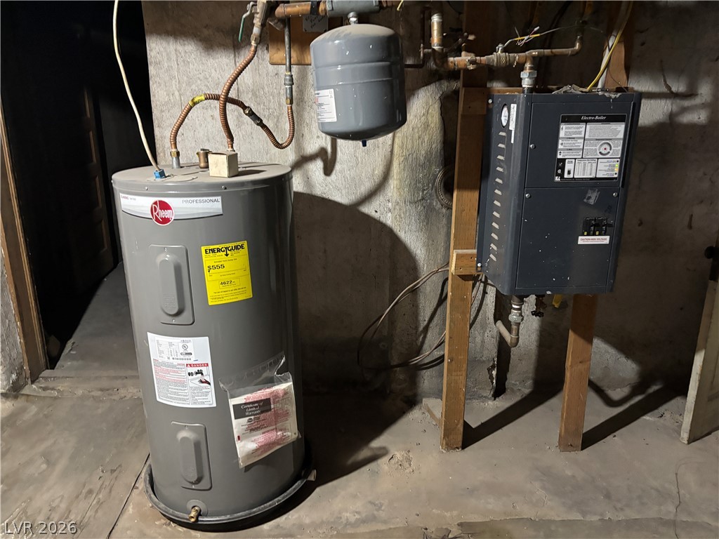 591 Campton Street Ely, NV 89301 - Photo 29 of 29 Utility room featuring water heater & water softener