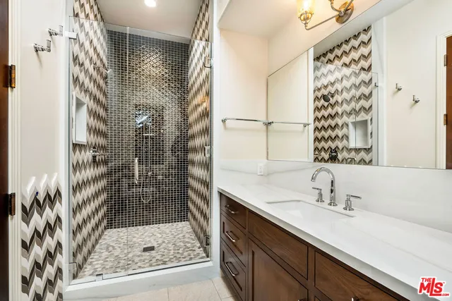 a bathroom with a sink and a shower
