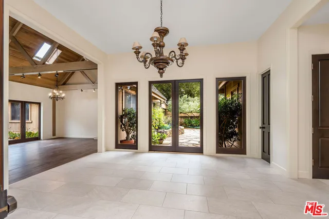 a view of an entryway with a chandelier