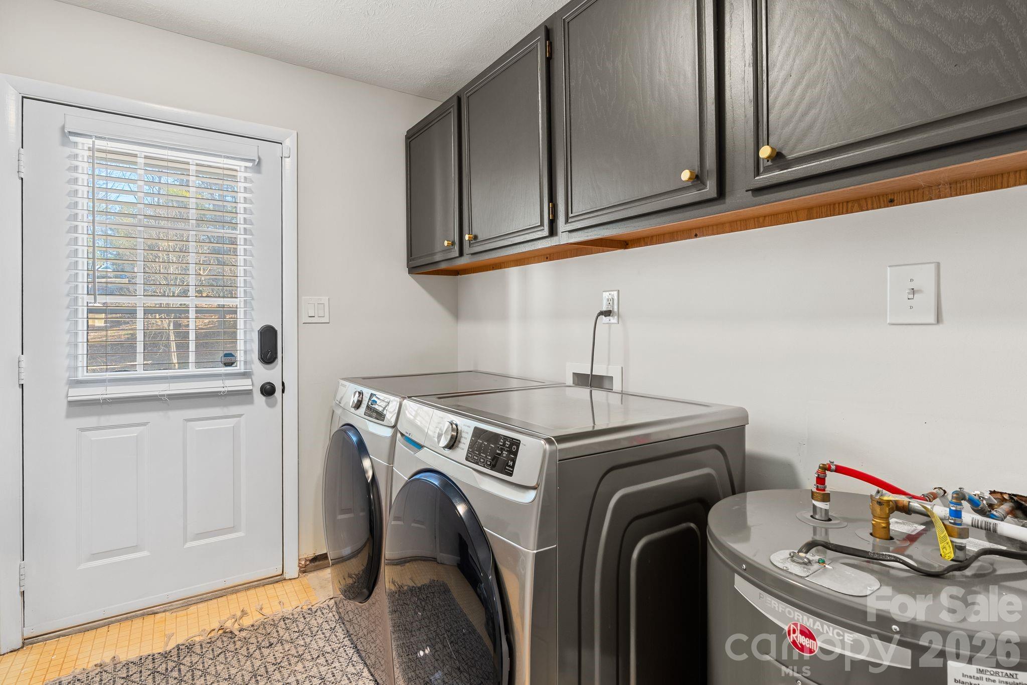 1348 Jenkins Valley Road Alexander, NC 28701 - Photo 15 of 44 a utility room with sink dryer and washer